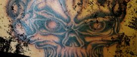 Black & White Flaming Skull Shoulder Tattoo