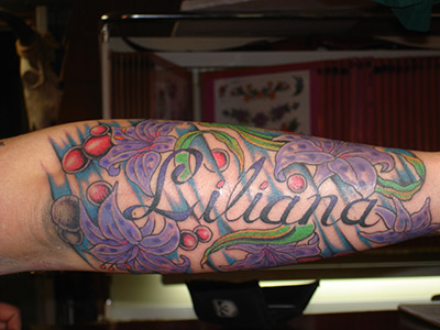 Full Color Forearm Tattoo With Purple Flowers