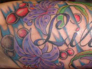 Full Color Forearm Tattoo With Purple Flowers