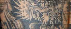 Black and White Dragon Arm Tattoo