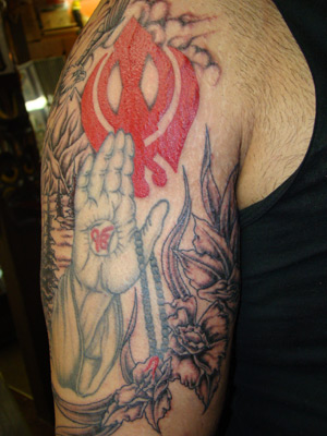 This sikh inspired tattoo was done in two stages. The hands were done first 