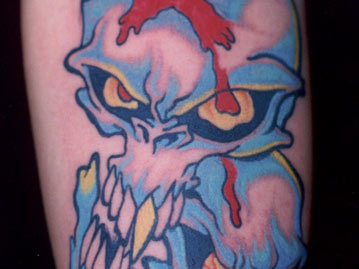 Vivid Red And Blue Evil Skull Tattoo